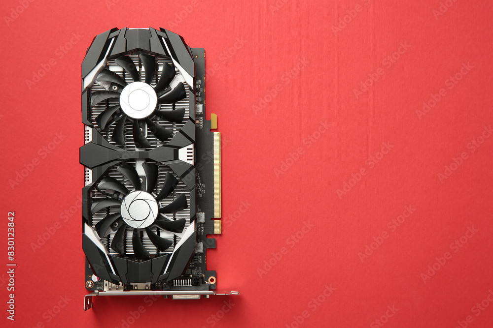 Fototapete computer graphics card on red background, top view. space for text