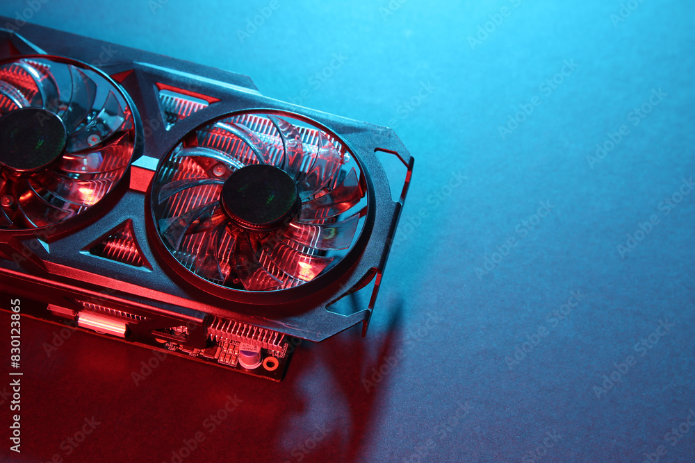 Fototapete computer graphics card on color background, above view. space for text