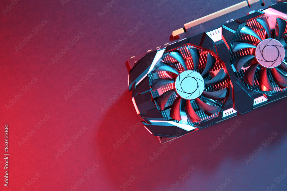 Fototapete computer graphics card on color background, top view. space for text