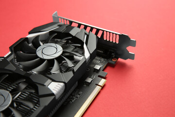 Computer graphics card on red background, closeup