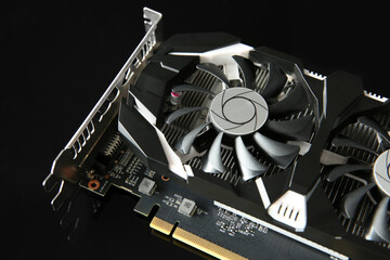 Computer graphics card on dark mirror surface, closeup