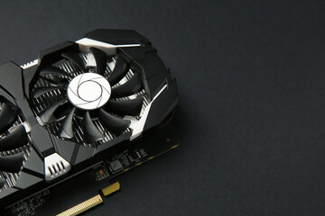 Computer graphics card on black background, closeup. Space for text