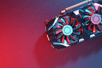 Computer graphics card on color background, top view. Space for text