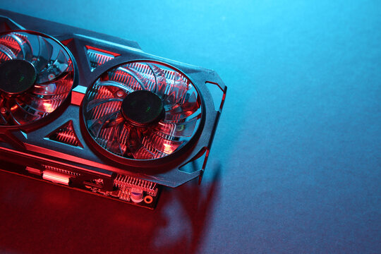 Computer graphics card on color background, above view. Space for text