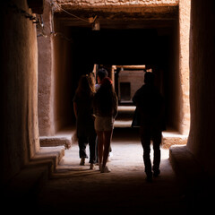 A bunch of tourists walking in Gite el Khorbat kasbah. Tinejdad, Morocco