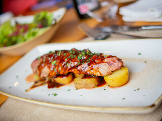 roast pork on potatoes in a fancy restaurant
