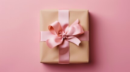 A beautifully wrapped gift box with a satin ribbon, positioned at the golden ratio point in front of a soft pastel pink background