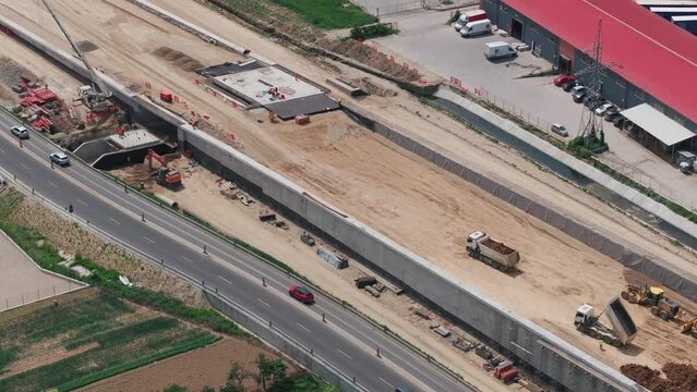 Romania A1 highway construction site. Aerial 4k video of A1 road that connects Bucharest Pitesti highway with Curtea de Arges and Sibiu. Infrastructure construction industry in Romania.
