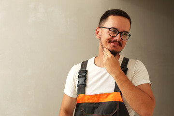 Young man in builder gear, construction worker portrait, advertising banner with copy space. Close up. Portrait of young construction worker, design template for copy space