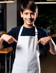 Boy smiling and pointing at his white apron to promote or advertise