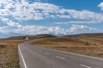 Snowy peak of Mount Elbrus in spring. Road to Dzhyly Su. Caucasus mountains. Jilly-Su region. Kabardino-Balkaria Reublic. Panorama of Elbrus.