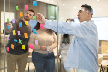 Collaborative brainstorming session with sticky notes