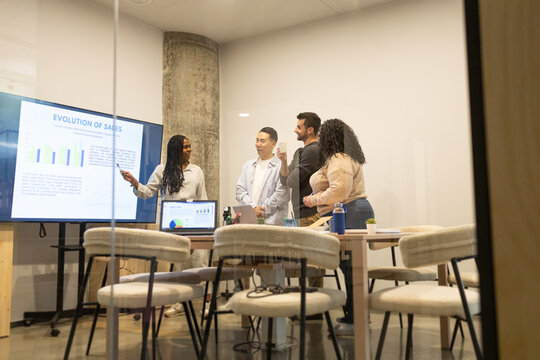Diverse Team Discussing Business Strategy in Coworking Space