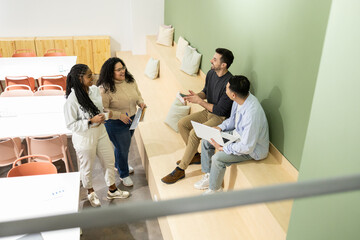Diverse group of friends collaborating in modern coworking space