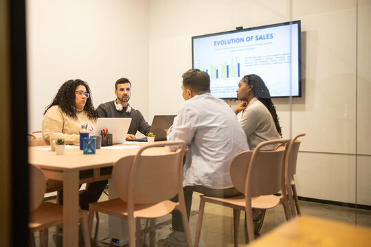 Team collaboration during a presentation in a coworking space