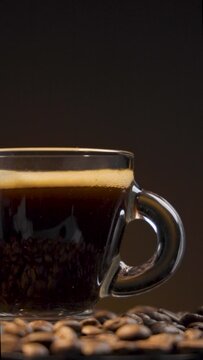 Brewing Beauty: Slow Motion Coffee Cup and Roasted Beans