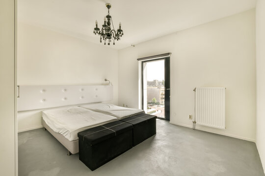Minimalistic bedroom interior with ample lighting