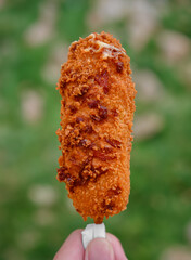 Korean hot dog made on a stick and breaded sold in Liberdade, São Paulo, Brazil.