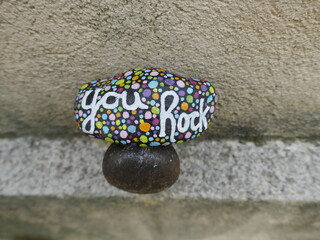 You rock kindness rock balanced on metal pin
