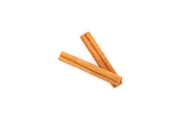 Cinnamon sticks isolated on white background. Cinnamon roll. Spicy spice for baking, desserts and drinks. Fragrant ground cinnamon.