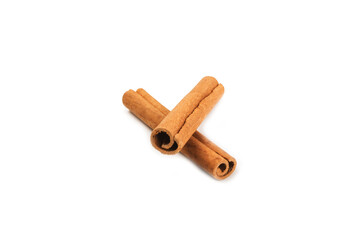 Cinnamon sticks isolated on white background. Cinnamon roll. Spicy spice for baking, desserts and drinks. Fragrant ground cinnamon.