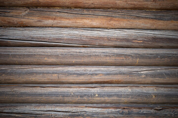 Wooden background with cracked logs light vignette around the edges