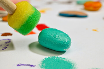 Close-up of a stencil painted river stone