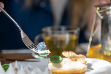 A fork is sticking out of a delicious pastry on a plate, ready to be enjoyed for breakfast.