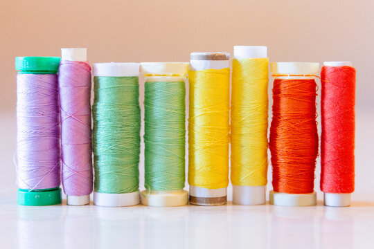 Colorful Sewing Thread Spools on a Table