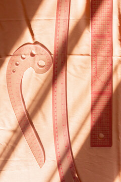 Sewing tools with shadows on fabric background