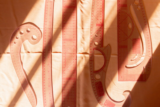 Sewing Tools Cast Shadows on Fabric at Workshop