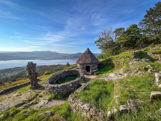 Ruins of ancient celtic settlement stone dwellings in mount of Santa Tecla archaeological site,...