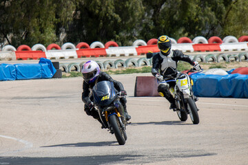 Female Racer Leading in Motorcycle Race