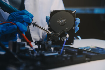 Close up of Technician measuring voltage electronic circuit board television, Service after sale fix electric equipment within insurance.