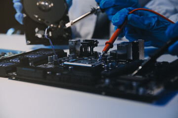Obraz premium Close up of Technician measuring voltage electronic circuit board television, Service after sale fix electric equipment within insurance.