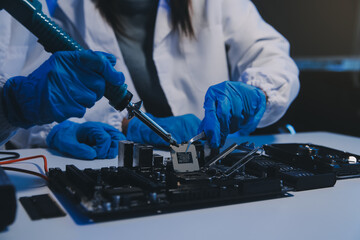 Close up of Technician measuring voltage electronic circuit board television, Service after sale fix electric equipment within insurance.