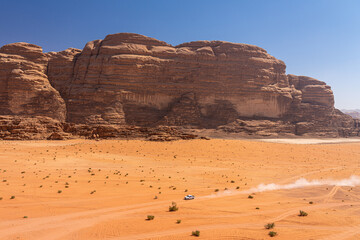 Adventurous Desert Drive in Wadi Rum, Jordan: Stunning Sandstone Formations and Expansive Red Sand...