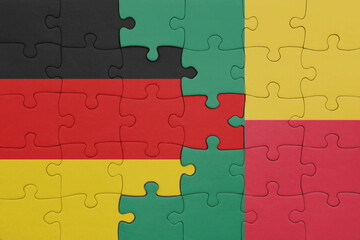 puzzle with the colourful national flag of benin and flag of germany.