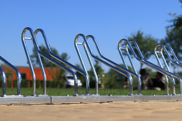 Parking for bicycles in the park. Metal structure for parking bicycles close-up. Bicycle parking on...
