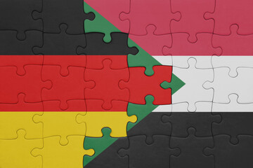 puzzle with the colourful national flag of sudan and flag of germany.