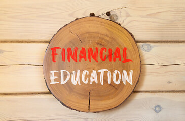 Financial education symbol. Concept words Financial education on beautiful wooden circle. Beautiful...