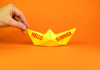 Hello summer symbol. Concept words Hello summer on beautiful yellow paper boat. Beautiful orange...