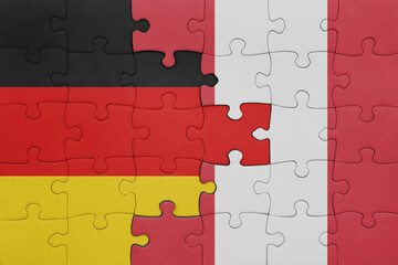 puzzle with the colourful national flag of peru and flag of germany.