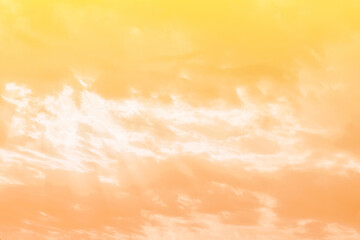 Yellow orange golden sky pastel with fluffy cloud. Summer sunset nature landscape. Beautiful sunrise background. Cloudscape gradient abstract.