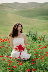 Model, beautiful woman relaxing on poppy field. Lifestyle.