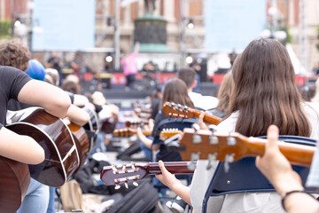 Guitar players at music concert or outdoors musical event or performance. Music session or ceremony...