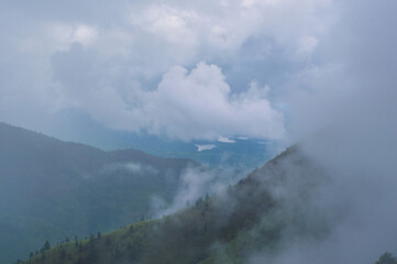 Fototapeta premium View from Baker's Bend, Clouds Touching Mountain Top,Cool Autumn Vibes, Nonpareil Mountain, Belihuloya, Sri Lanka
