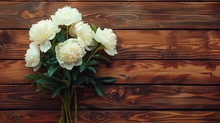 A white flower bouquet atop a wooden table Nearby, a wooden wall with its planks aligned, and behind, the same texture continues on a larger scale Beneath, a