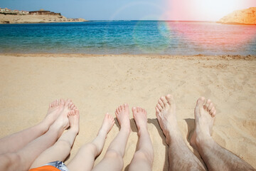 Stylish beautiful legs on the sea shore background