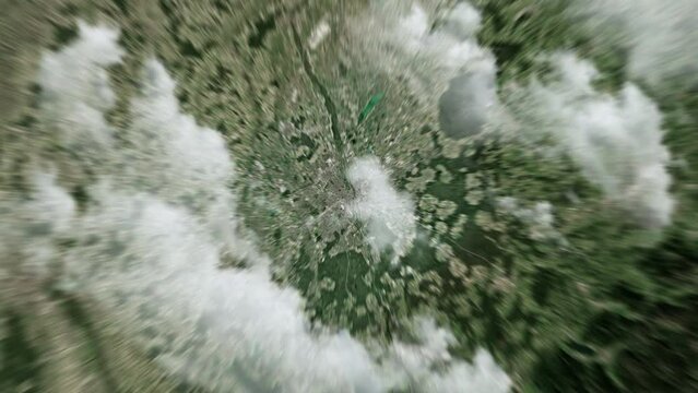 Zooming on Munich, Germany. Earth zoom in from outer space to city. The animation continues by zoom out through clouds and atmosphere into space. View of the Earth at night. Images from NASA. 4K